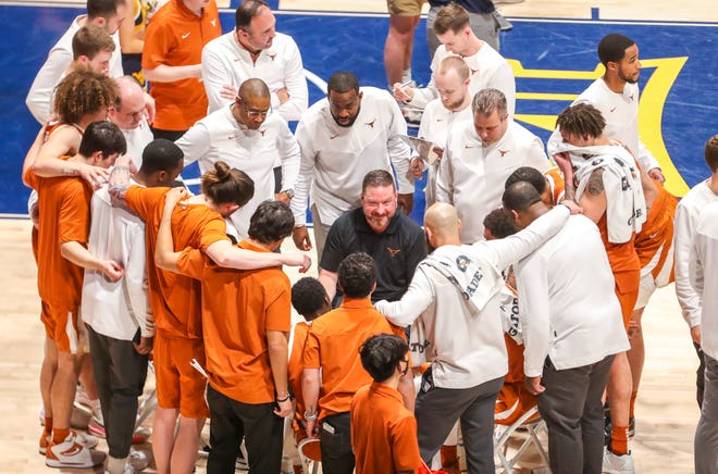 Texas men's basketball coach Chris Beard, center, is excited about the makeup of his second Longhorns team: five who played for him last season, two additions from the NCAA transfer portal and four freshmen, including two McDonald’s All-Americans. The season opener is Monday.