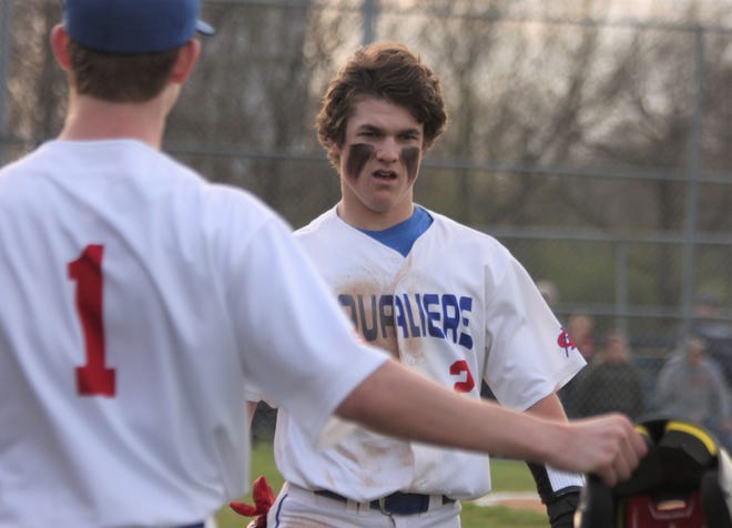 Carlinville junior shortstop/pitcher Henry Kufa celebrates after scoring a run against Litchfield on Tuesday, April 12.