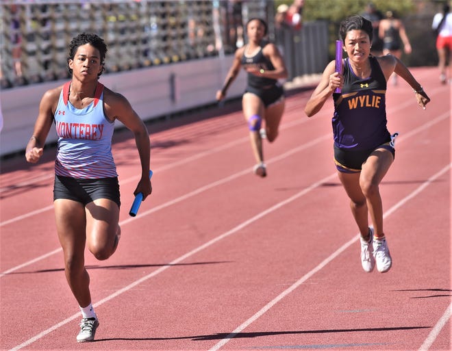 Lubbock Monterey's Sydney Tullah, left, races to the finish line ahead of Wylie's Page Hughes, right, in the girls 400-meter relay at the District 4-5A track and field meet Thursday, April 14, 2022, at Sandifer Stadium in Abilene. Monterey won in 49.98 seconds, while Wylie was second (49.47).