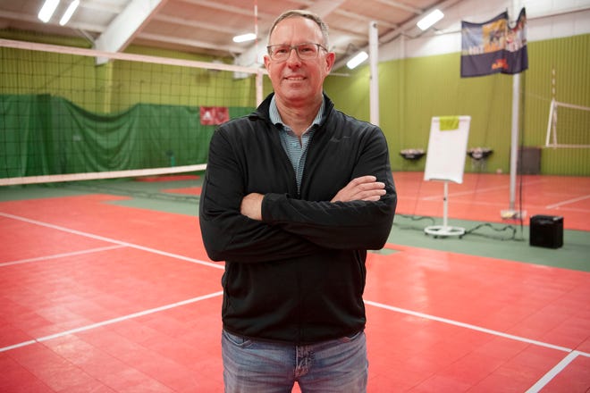 Mark Harvey, owner of Minges Creek Athletic Club, stands for a portrait on the volleyball court in Battle Creek, Michigan on Thursday, April 14, 2022.