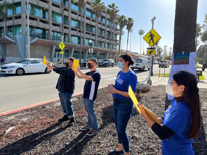Kyle De La Torre, from left, Colyn Messecar, Maria Navarro and Ocil Herrejon show their support for rent control Wednesday outside Oxnard City Hall. The City Council later took a first vote toward rent control.