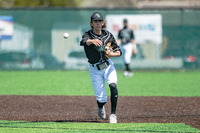 Rock Bridge's Ty  Thompson (4) throws across the diamond to first base during the Bruins' 4-3 loss against Blair Oaks at the Columbia Tournament on Saturday, April 16, 2022, at Rock Bridge High School.