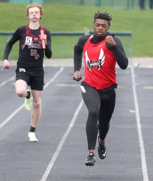 Caleb Ruffin, right, of McKinley anchors the boys 4x200 meter relay during the Eagle Elite Track Meet at GlenOak on Saturday, April 16, 2022. McKinley won the event.