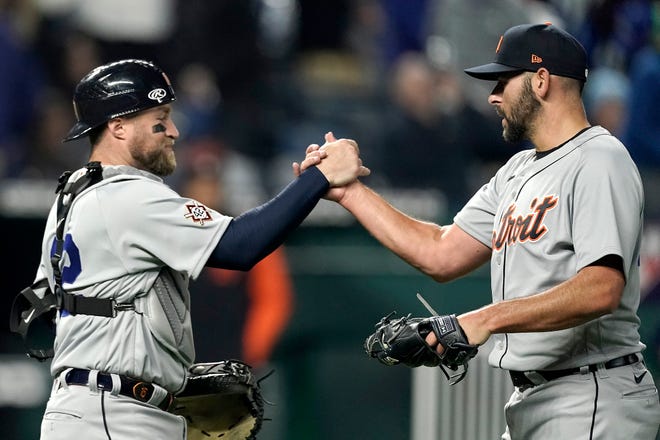 Tigers catcher Tucker Barnhart, left, and pitcher Michael Fulmer celebrate after their baseball game against the Royals Friday, April 15, 2022, in Kansas City, Mo. The Tigers won 2-1.