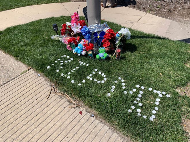 A small tribute stands where Michael Duerson III, 16, was fatally shot Sunday, April 10, 2022 in the 5600 block of East 30th Street, near North Ritter and Massachusetts avenues.