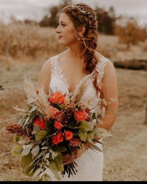 Lindsey Forbes, makeup artist and owner of Fades Beards and Beauty, highlighted recent trends she is seeing in bridal hair and makeup, as seen here on recent bride, Morgan Sowers. Sowers chose pearl accessories, hair in a half up style, and light, classy, natural makeup.