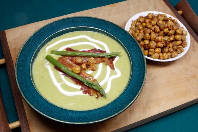 This healthier version of Cream of Asparagus Soup is thickened with potatoes and leeks and uses Greek yogurt instead of cream. It can be topped with Roasted Chickpea Croutons, bacon, more yogurt and/or pieces of asparagus.