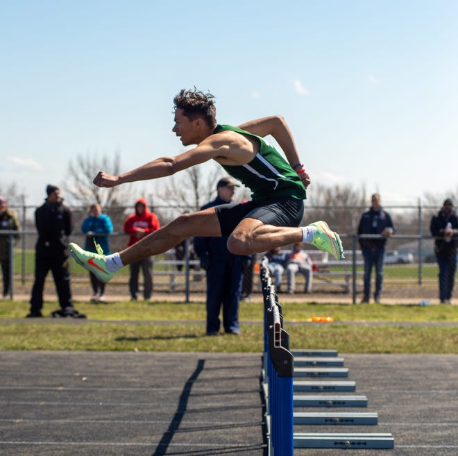 Madison senior Isaac Brooks clears a hurdle at the 2022 Mansfield Mehock Relays on Saturday.