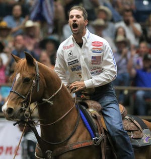 Shane Hanchey reacts after seeing his time in tie-down roping at the Cinch Chute-Out at Foster Communications Coliseum on Saturday, April 16, 2022.