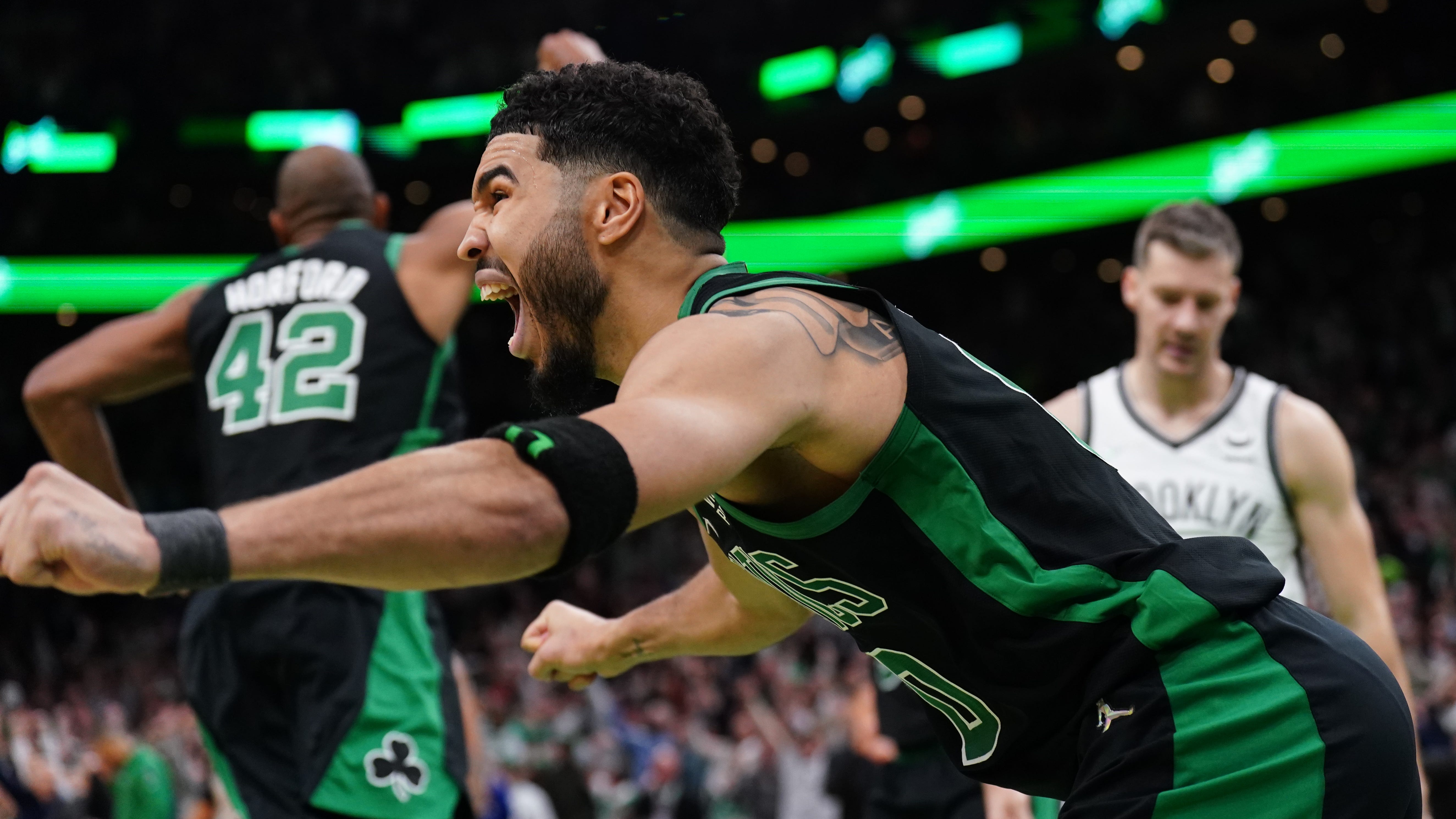 Boston Celtics forward Jayson Tatum celebrates his game-winning layup against the Brooklyn Nets.