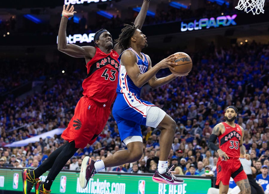 First round: Sixers guard Tyrese Maxey (0) drives to the basket past Raptors defender Pascal Siakam (43) during the second half of Game 1.