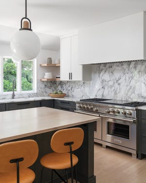 Boldly patterned Carrara marble is a focal point in the restyled Medick Estates kitchen in Worthington.