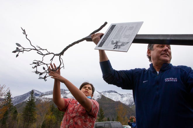 Talent Middle School student Aaron Chavez, 14, left, and Phoenix-Talent School District Superintendent Brent Barry deliver a medal sculpture of a manzanita tree branch to McKenzie High School in Blue River on Monday, April 18, 2022.