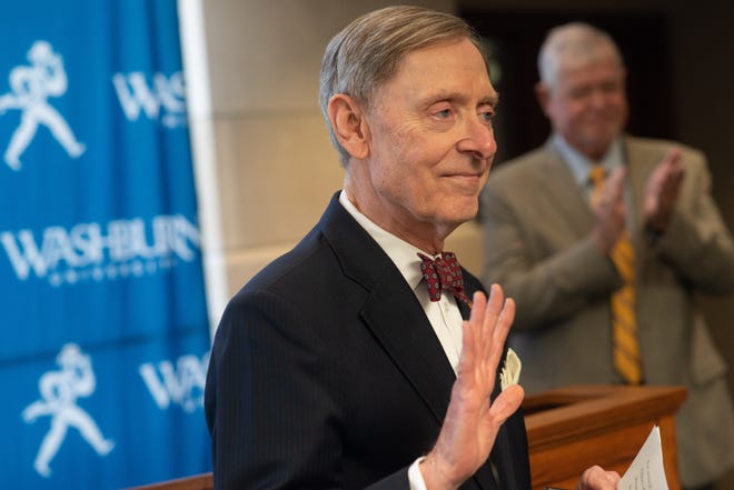Jerry Farley, president at Washburn University for the past 25 years, waves goodbye after a press conference where he announced his retirement will happen this coming September.