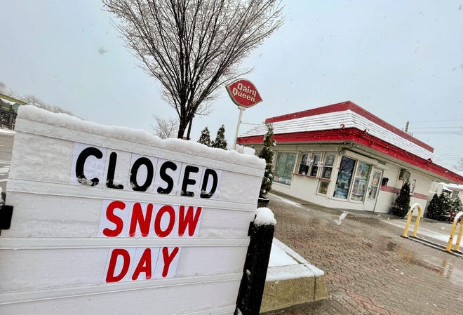 A snow-covered sign outside the Dairy Queen declaring a 'snow day'  seems like an unlikely sight more than halfway through the month of April, but this is Michigan, after all.