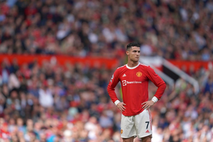 Manchester United's Cristiano Ronaldo stands on the pitch during the English Premier League soccer match between Manchester United and Norwich City at Old Trafford stadium in Manchester, England, Saturday, April 16, 2022.