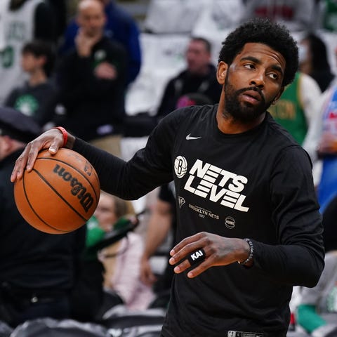 Nets guard Kyrie Irving stares down Boston Celtics