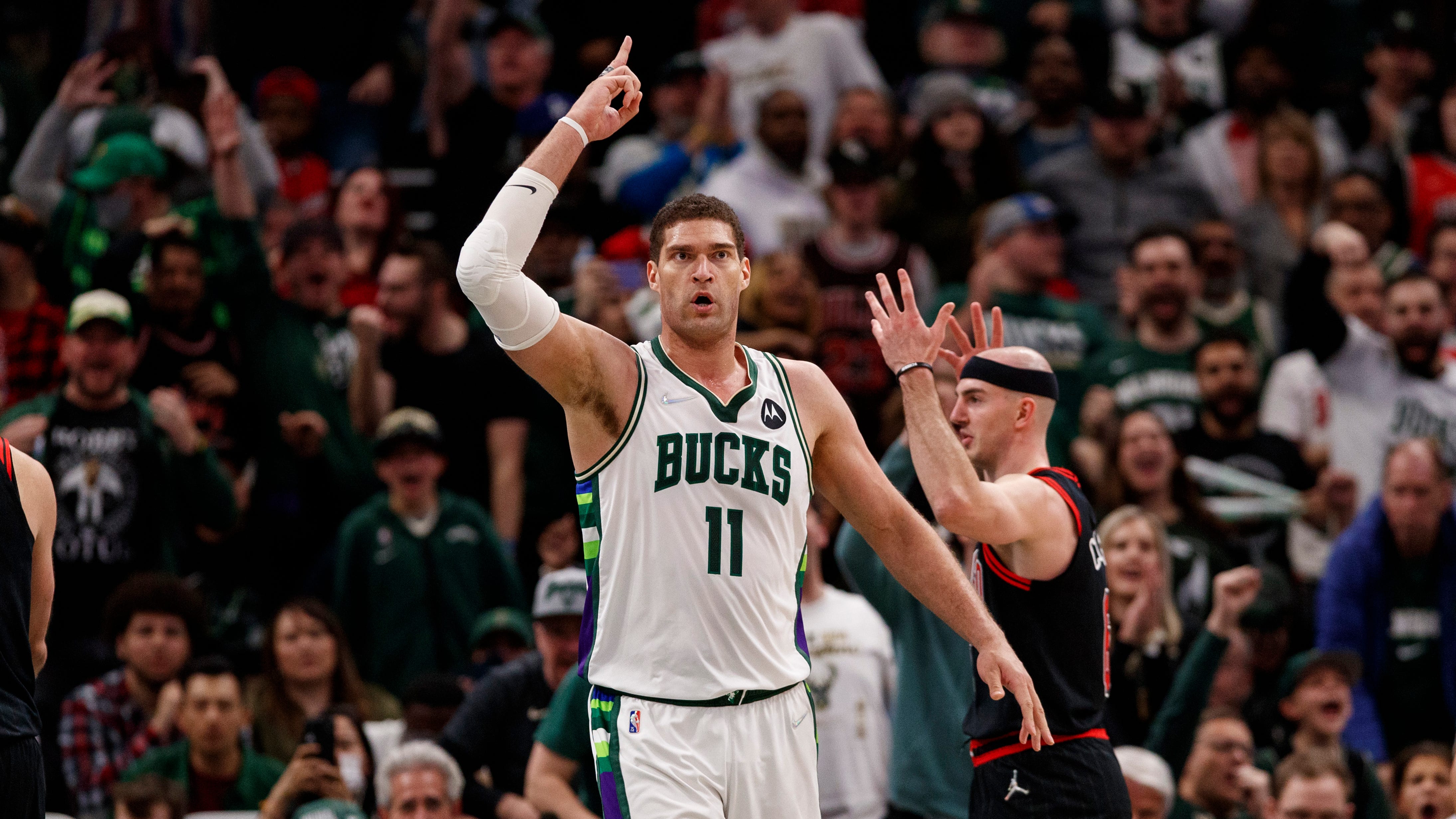 Milwaukee Bucks center Brook Lopez celebrates after scoring a basket during the fourth quarter against the Chicago Bulls.