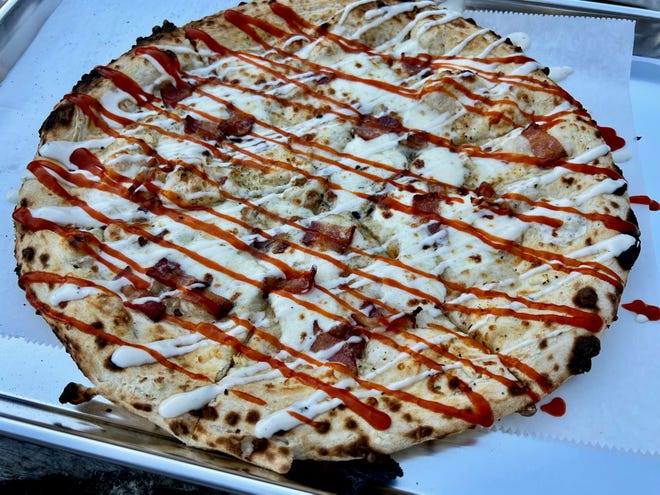 The BBR is a wood-fired white pizza (no sauce) topped with bacon, spicy buffalo sauce and ranch dressing.