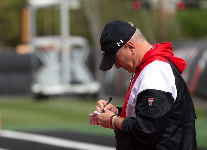 Texas Tech coach Joey McGuire takes notes during an April 19 spring practice. The Red Raiders, about to start summer workouts, announced the addition Thursday of defensive tackle Vidal Scott from Arkansas State.