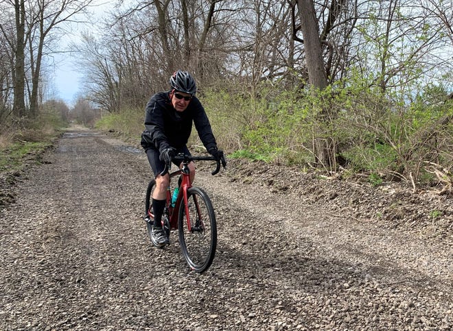 Mike Kuepper rides his bike where he and fellow organizers of the Nickel Plate Trail are planning a 15-mile extension, yet to be built. There will be a hike on 2 miles of it April 23 south of Peru, Ind.