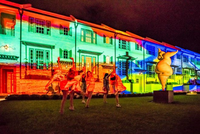 People dance in front of a building during the 2021 Digital Graffiti Festival at Alys Beach. The Alys Foundation has announced the finalists and residency artists for this year's show scheduled for May 13-14.