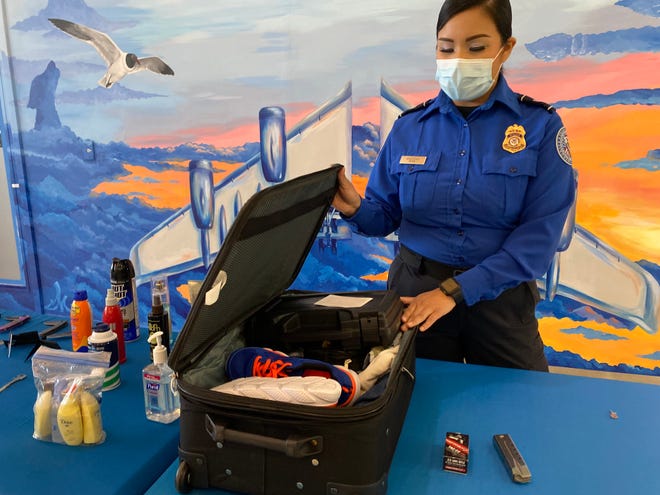 Melissa Verastegui, a Transportation Security Administration officer at the Corpus Christi International Airport, demonstrates how to pack a firearm in a checked bag on April 19, 2022. TSA officers found 36 loaded weapons at CCIA in 2021.