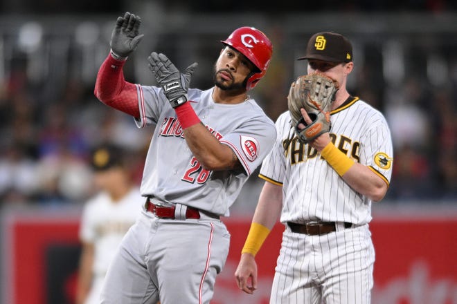 Apr 18, 2022; San Diego, California, USA; Cincinnati Reds left fielder Tommy Pham (28) reacts after hitting a double as San Diego Padres second baseman hitter Jake Cronenworth (right) looks on during the third inning at Petco Park. Mandatory Credit: Orlando Ramirez-USA TODAY Sports
