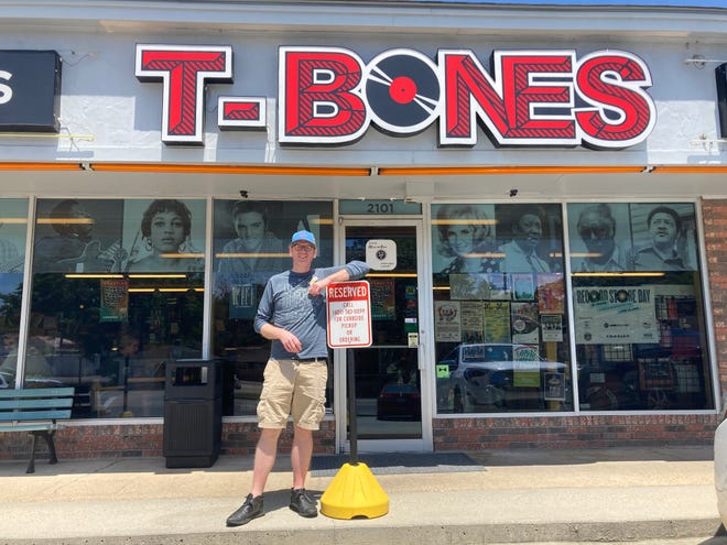 Mik Davis, record store manager of T-Bones Records and Cafe in Hattiesburg, Miss., on Tuesday, April 19, 2022.