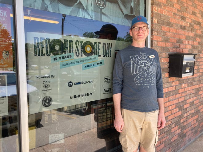 Mik Davis, record store manager of T-Bones Records and Cafe in Hattiesburg, Miss., on Tuesday, April 19, 2022.