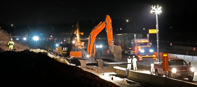 Construction crews work on building a new Port Washington Road bridge over I-43 Monday in Mequon. The work is part of the $500 million I-43 north-south reconstruction and expansion project.