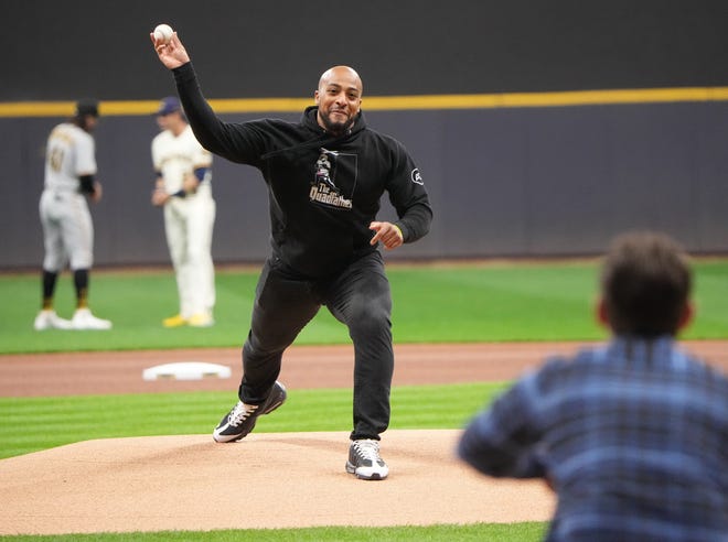 Green Bay Packers running back AJ Dillon throws the ceremonial first pitch before the Milwaukee Brewers game against the Pittsburgh Pirates Monday night.