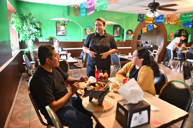 Barbara Casillas, manager of Las Alteñitas Mexican Restaurant, checks on her customers during lunch Tuesday, April 19, 2022. The new restaurant opened April 6 and offers authentic Mexican food.