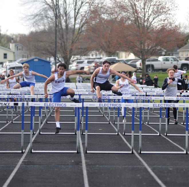 Philo's Kyler Nader edges River View's Dominic Durben in the 110 hurdles during a MVL tri-meet on Tuesday. Athletes from River View, Tri-Valley and Philo took part in the meet at the Philo Athletic Complex.