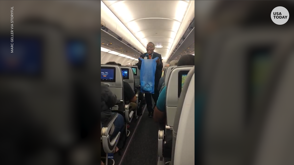 Flight attendant sings as mask mandate ends