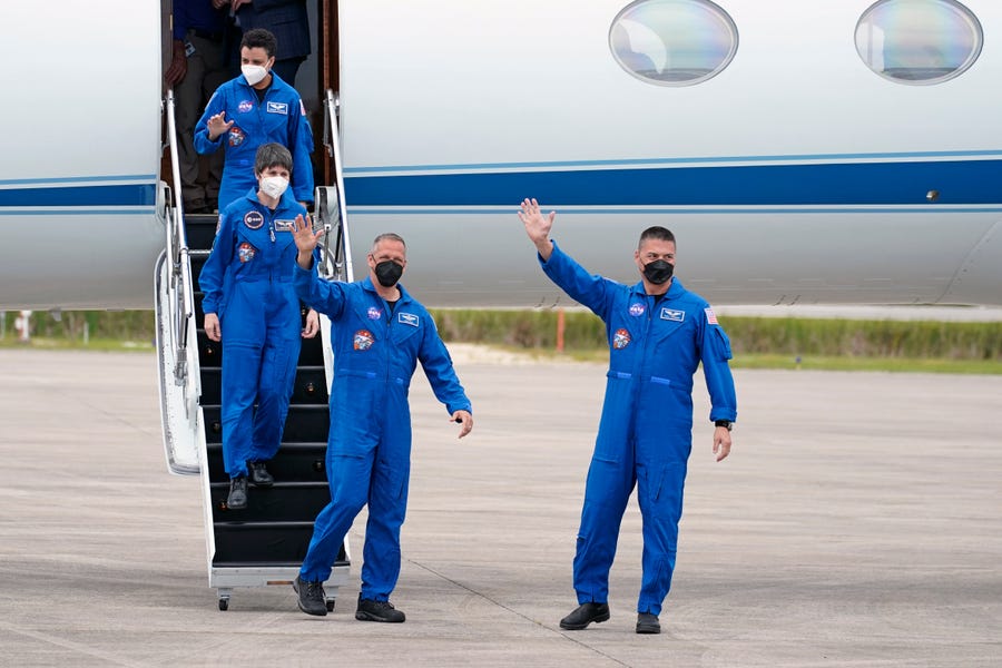 NASA "Crew4" mission astronauts, from left, mission specialist, Jessica Watkins, mission specialist, European Space Agency astronaut Samantha Cristoforetti, of Italy, pilot Bob Hines and commander, Kjell Lindgren arrive at the Kennedy Space Center in Cape Canaveral, Fla., Monday, April 18, 2022. Their launch to the International Space Station is scheduled for Saturday, April 23. (AP Photo/John Raoux) ORG XMIT: KSC101