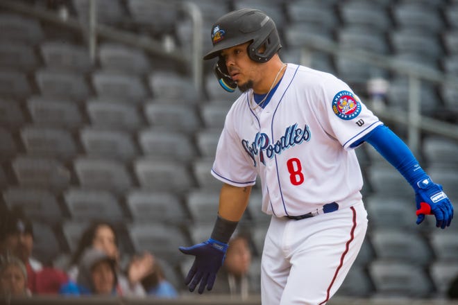 Amarillo Sod Poodles catcher Juan Centeno (8) rounds the bases after hitting a home run against the San Antonio Missions on Tuesday, April 19, 2022, at HODGETOWN in Amarillo, Texas.