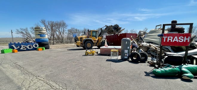 Jordon Sutton operates a front-end loader at the Brown County Landfill. The landfill's free spring cleanup period starts today.