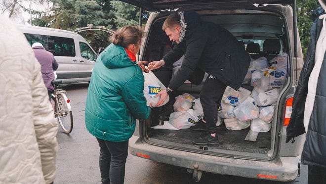 Workers with Youth With a Mission Kyiv distribute food to Ukrainians who have been displaced by the war with Russia.
