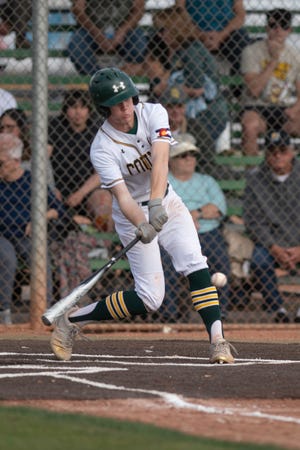 Pueblo County's Jace Barger swings on a pitch during a matchup with Pueblo West at Andenucio Field on April 19.