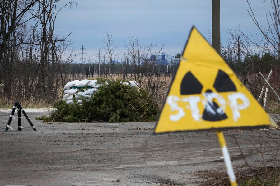 A Russian firing position sits adjacent to the Chernobyl nuclear power plant near Chernobyl, Ukraine, Saturday, April 16, 2022. Thousands of tanks and troops rumbled into the forested Chernobyl exclusion zone in the earliest hours of Russia's invasion of Ukraine in February, churning up highly contaminated soil from the site of the 1986 accident that was the world's worst nuclear disaster. (AP Photo/Efrem Lukatsky) ORG XMIT: XEL203