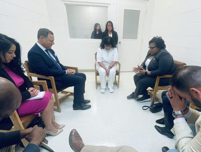Texas state Reps. Jeff Leach, Joe Moody, Lacey Hull, Victoria Criado, Rafael Anchia, Toni Rose and James White prayed April 6, 2022, with Melissa Lucio at Mountain View Unit in Gatesville, Texas, where the state houses women on death row.