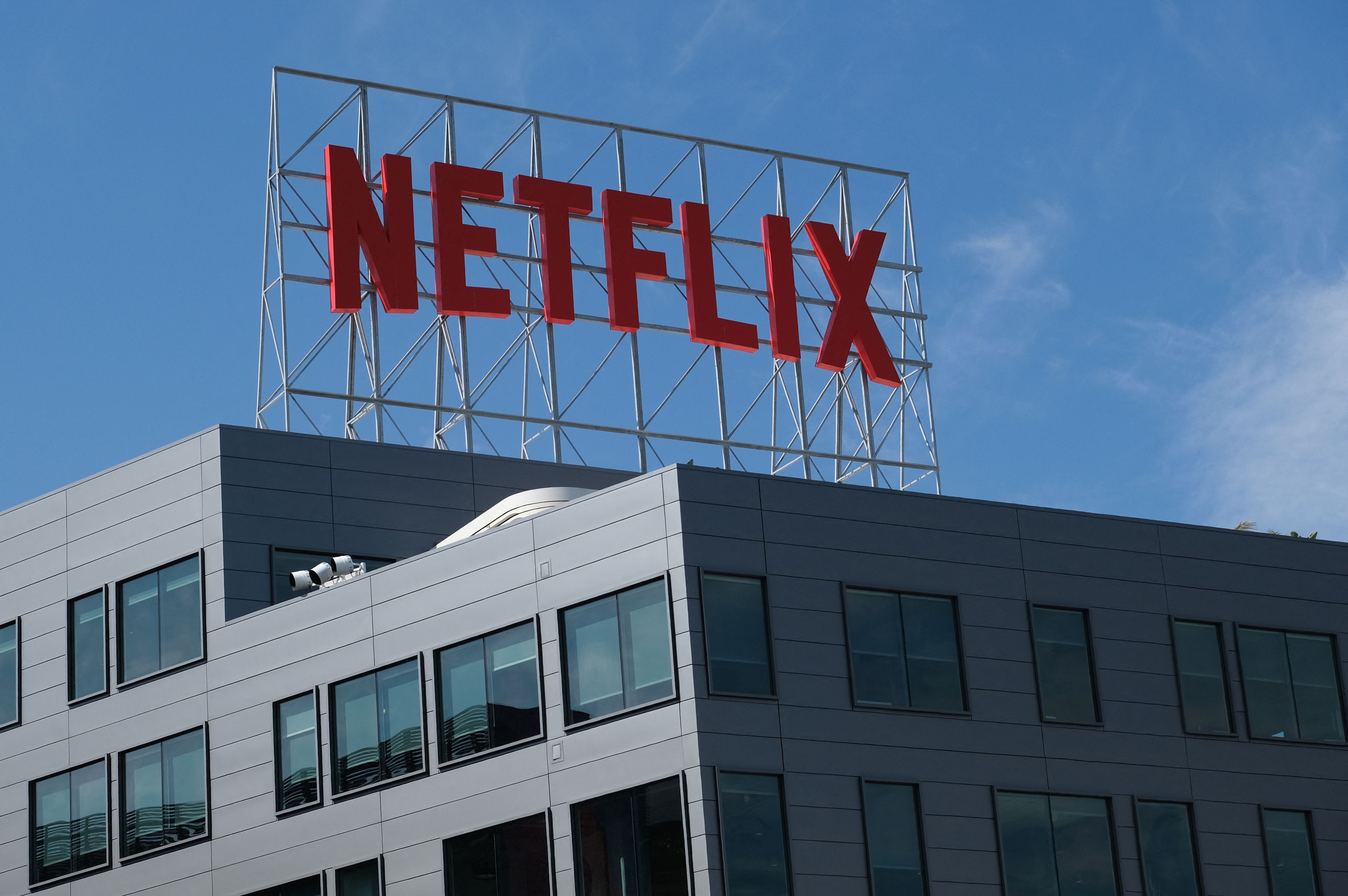A sign above a building featuring the Netflix logo.