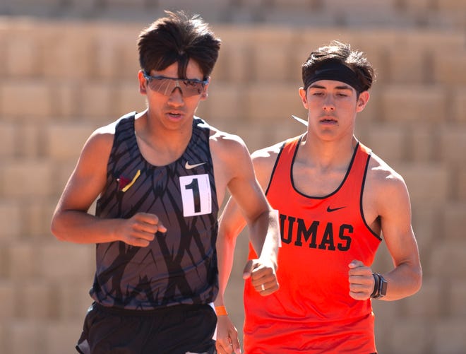 Big Spring's Roman Perez, left, and Dumas' Noah Williams compete in the 3,200 meter run at the Districts 3/4-4A track and field meet Thursday at Lowrey Field at PlainsCapital Park.