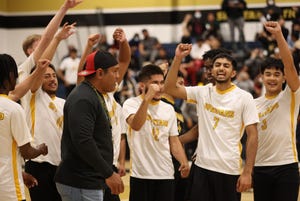 Lathrop boys volleyball in a huddle up during the team's April 12, 2022 match against Ripon Christian in Lathrop. The Spartans won the match in five sets to remain as the only undefeated team in the Sac-Joaquin Section.