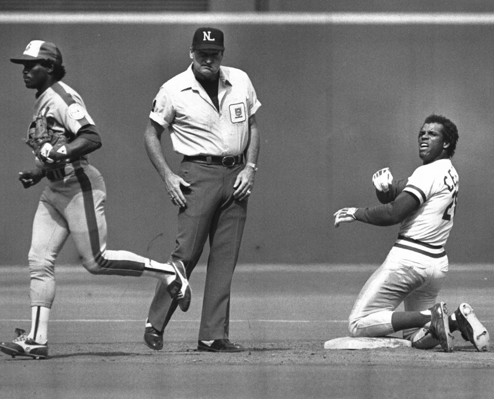 MAY 24, 1982: Tim Raines leaves the field while Cesar Cedeno contemplates umpire Satch Davidson's out call on Cedeno's attempt to steal second base in the eighth inning of Sunday's game.