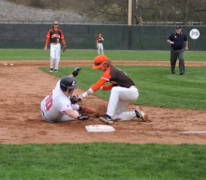Coshocton's Blake Alexander is tagged out going to third during a 12-3 loss to Meadowbrook on Wednesday at Lake Park.