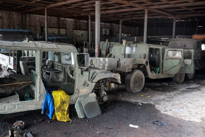 Damaged Ukrainian army military vehicles with a Ukrainian national flag, are seen at the partly destroyed Illich Iron & Steel Works Metallurgical Plant, in an area controlled by Russian-backed separatist forces in Mariupol, Ukraine. On Thursday, April 21, 2022, Russian President Vladimir Putin ordered his forces not to storm the last remaining Ukrainian stronghold in the besieged city of Mariupol.