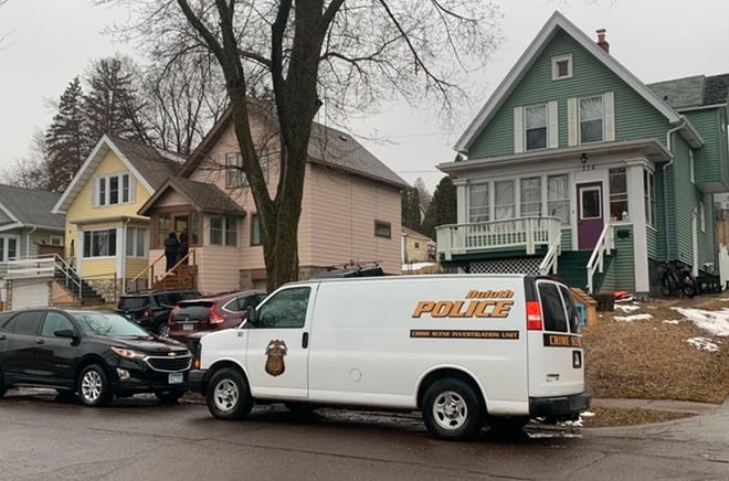 Police respond to a home in  Wednesday, April 20, 2022 in Duluth, Minn. Five people were found dead inside the home  after police received a report of a male experiencing a mental health crisis, authorities said. The dead included the male reported to be in crisis. (Christa Lawler/Star Tribune via AP)