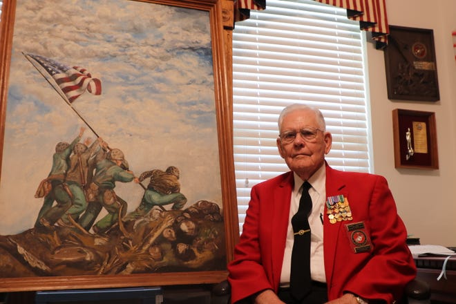 John Haynes, a U.S. Marine Corps veteran, sits inside his home office which is filled with metals and plaques from his distinguished military career on Thursday, April 21, 2022. Haynes is one of over 77 veterans set to board a Tallahassee plane headed for Maryland on Saturday, April 23, 2022.